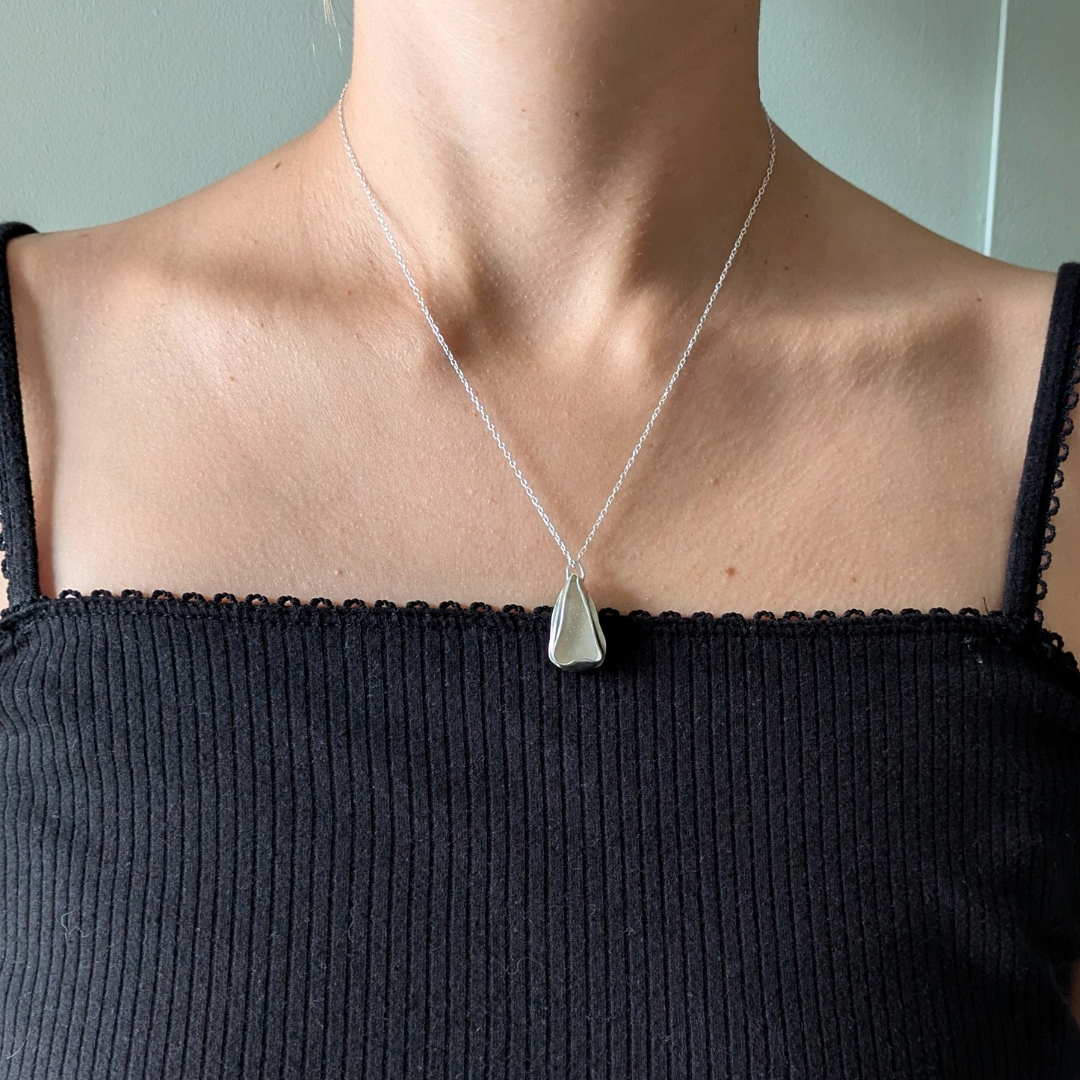 Close up of white sea glass pendant