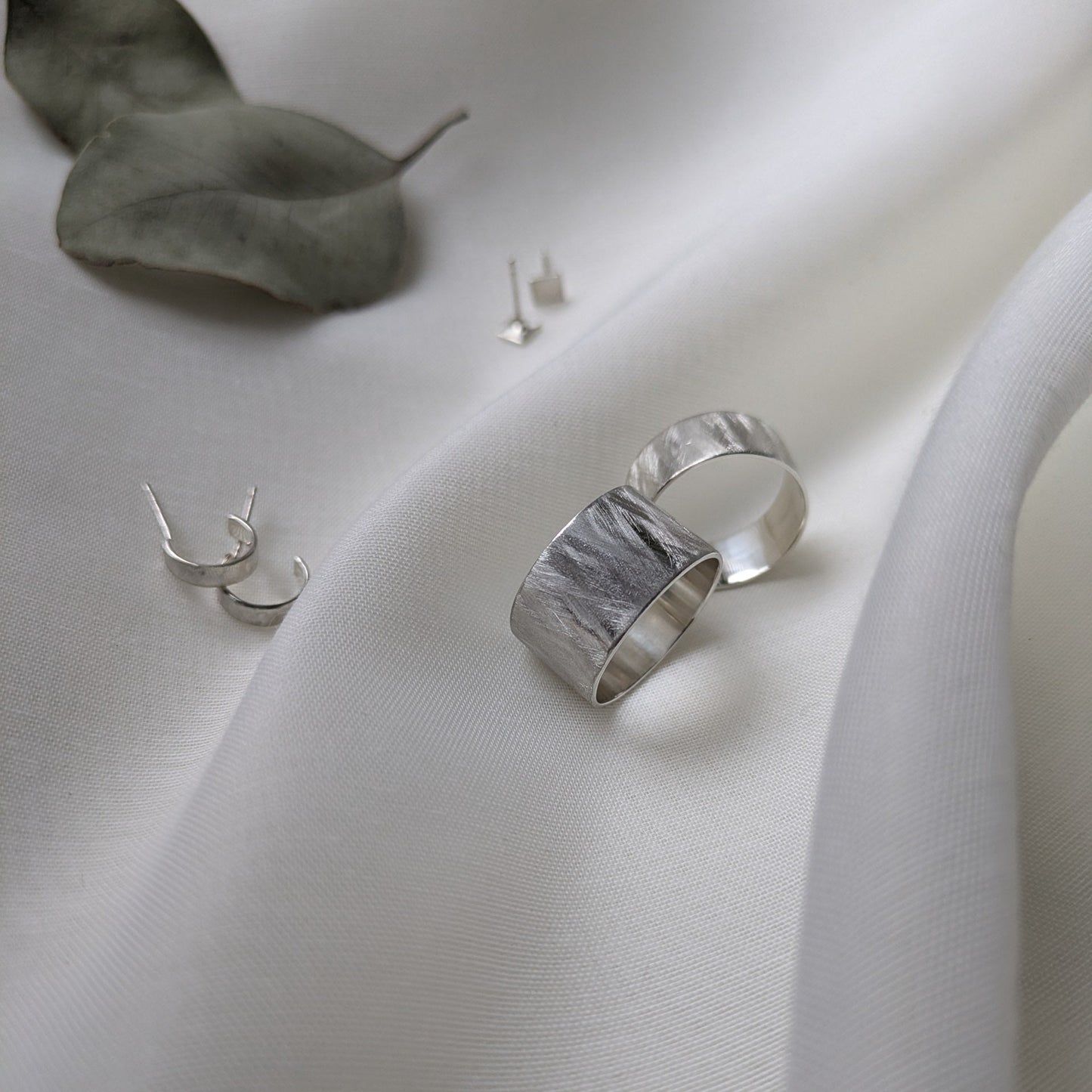 Wardie Collection- feather textured rings, small hoops and square studs.