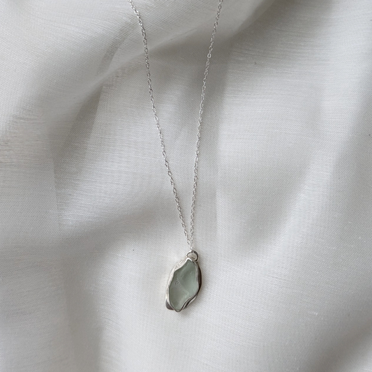 Turquoise sea glass necklace on white silk