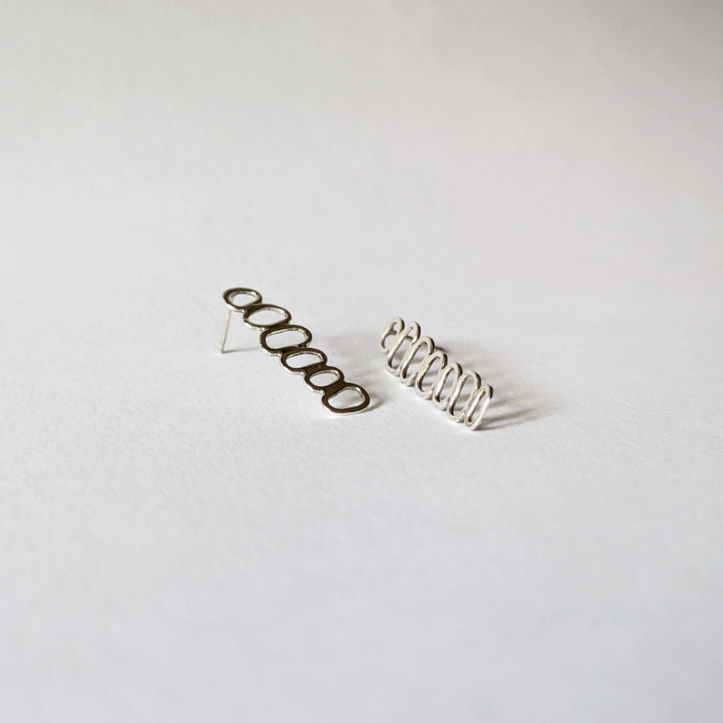 Silver Stacked Cairn Studs on white background