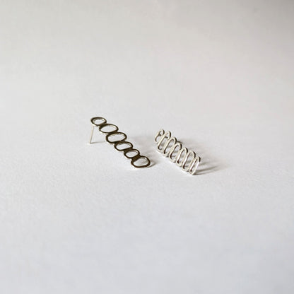 Silver Stacked Cairn Studs on white background